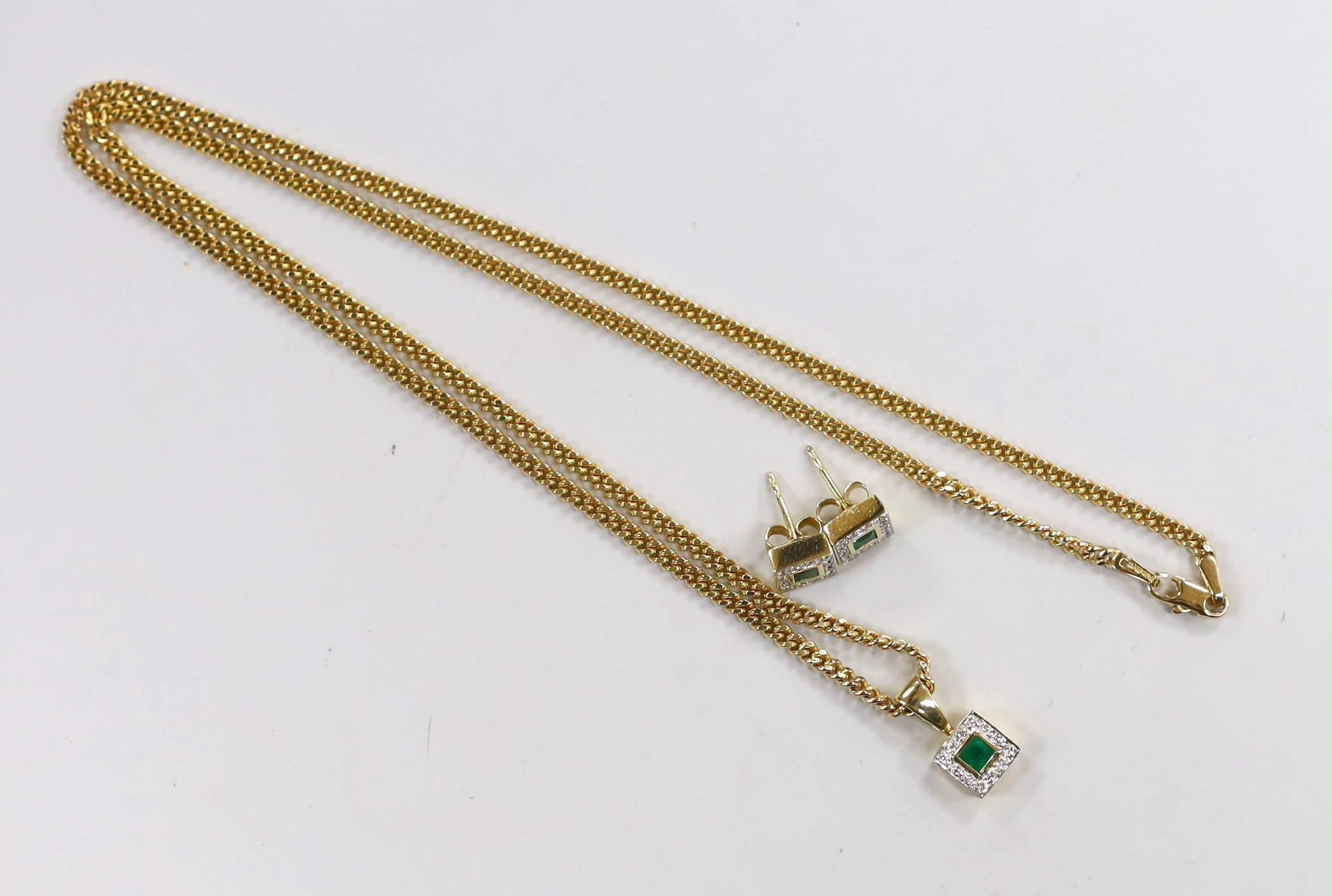 A modern 18ct gold, emerald and diamond set square cluster pendant, 7mm and a pair of matching ear studs, gross weight 4.6 grams, the pendant with an associated 9ct chain, 50cm, 8.6 grams.